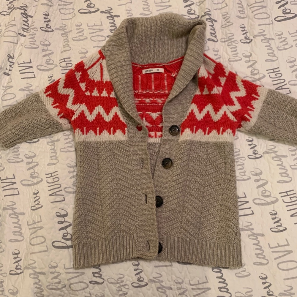 Women’s tan and red sweater